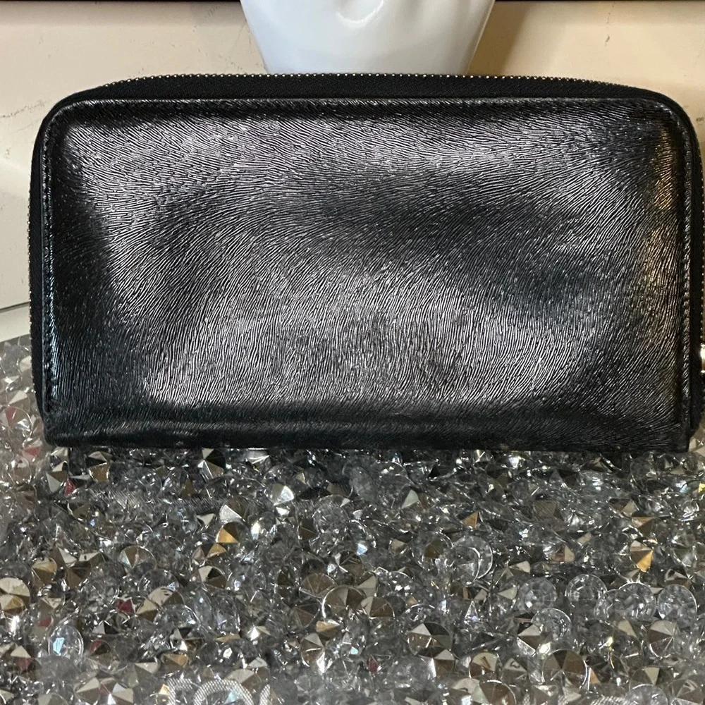 Vintage Fendi black patent leather zip-around continental wallet.